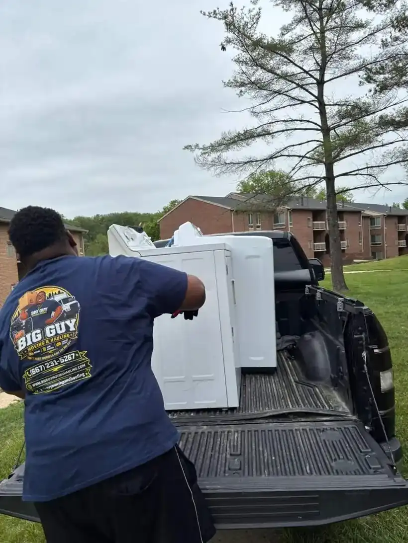 Big Guy Moving crew loading appliances