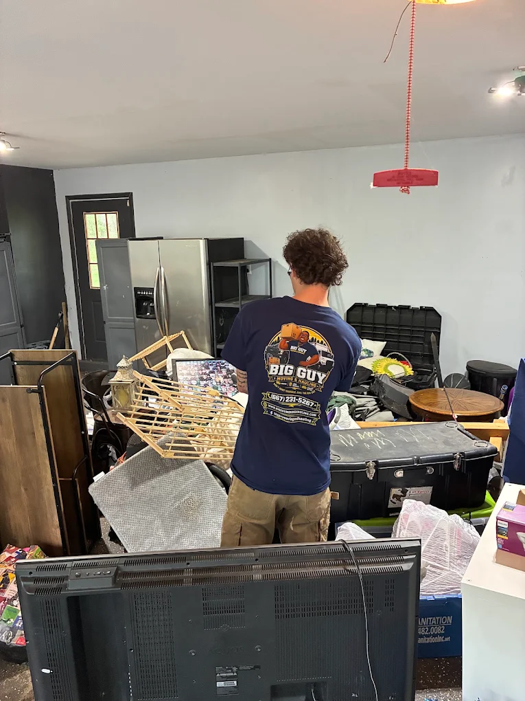 Crew member sorting a garage cleanout