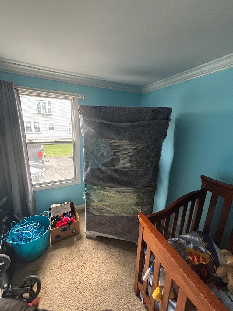 Wrapped mattress staged in a child's bedroom