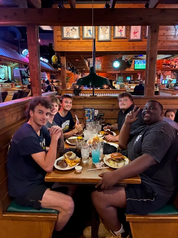 The Big Guy Moving crew at dinner after a job