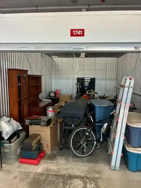 A packed storage unit before a Big Guy Moving cleanout