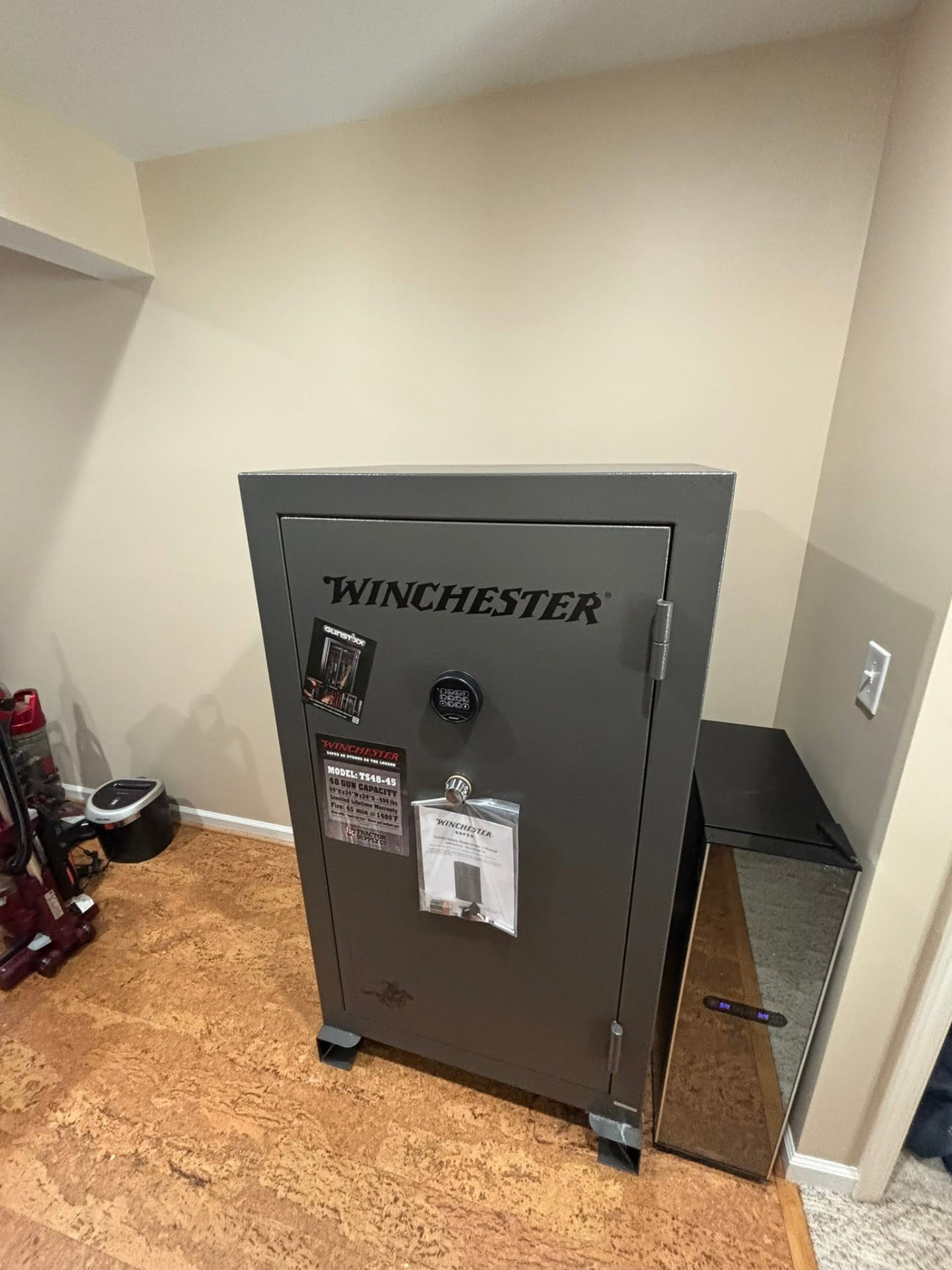 Winchester 48-gun safe placed in a finished basement by Big Guy Moving & Hauling